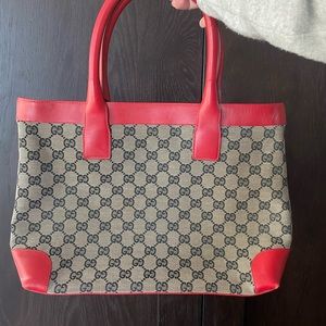 Gucci monogram tote with red leather trim. Very lightly worn.